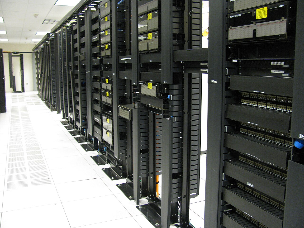 Rows of network cabinets in a computing facility